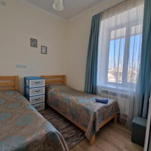Postel nebo postele na pokoji v ubytování Sunhome Stepanavan Guest House