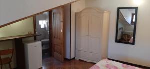 a room with a bathroom with a toilet and a mirror at villamuna in Ferentillo