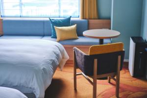 Postel nebo postele na pokoji v ubytování Miyako Hotel Kyoto Hachijo