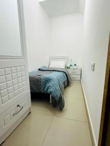 Postel nebo postele na pokoji v ubytování Prestige Pearl Abu Dhabi + 4 fotografie