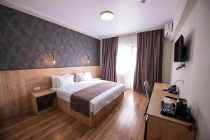 Postel nebo postele na pokoji v ubytování Astana Palace
