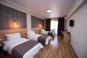 Postel nebo postele na pokoji v ubytování Astana Palace
