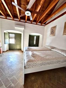 Postel nebo postele na pokoji v ubytování Casa en La Corredera