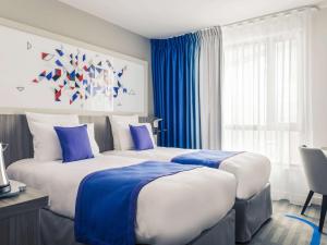 Katil atau katil-katil dalam bilik di Mercure Toulouse Sud