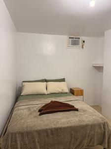 Ένα ή περισσότερα κρεβάτια σε δωμάτιο στο Balai Lokal