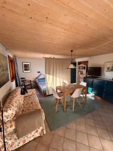 a bedroom with a bed and a table in a room at Blick in den Garten in Holzschlag