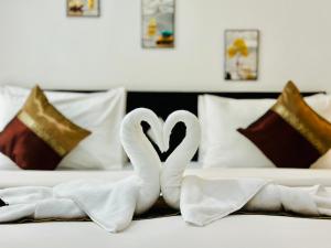 Postel nebo postele na pokoji v ubytování Hotel Baya Phuket