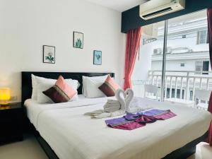 Postel nebo postele na pokoji v ubytování Hotel Baya Phuket