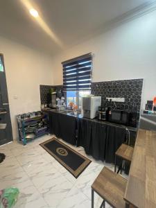 a room with a table with a counter top at Laman tokma in Kota Bharu