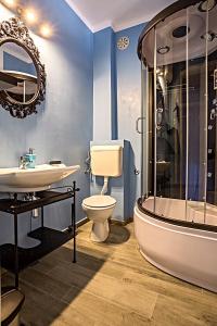 a bathroom with a tub and a toilet and a sink at Apartments Marija in Supetar +44 photos