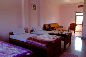 Кровать или кровати в номере Suma Guest House