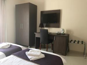 The Windsor Hotel客房内的一张或多张床位