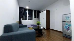a living room with a couch and a table at 18 ngõ 154 Đình Thôn in Hanoi