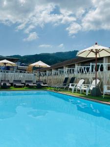 Bazén v ubytování PJ Patong Resortel nebo v jeho okolí