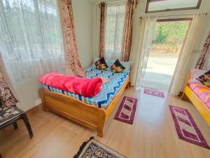 Ένα ή περισσότερα κρεβάτια σε δωμάτιο στο Eleba Guesthouse