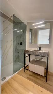 a bathroom with a sink and a shower at Huma BnB in Casapulla +57 photos