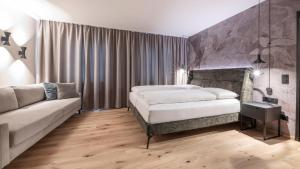 Ein Bett oder Betten in einem Zimmer der Unterkunft Hotel Almesberger
