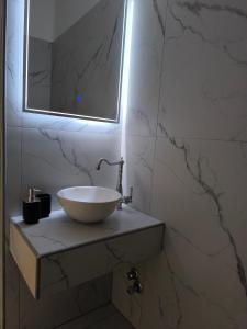 Koupelna v ubytování Vetti Rooms
