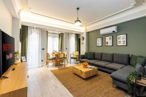 a living room with a couch and a table at Respiro Rooms in Istanbul