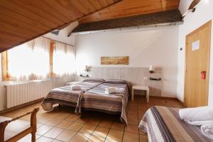 Postel nebo postele na pokoji v ubytování HOTEL LAMOGA