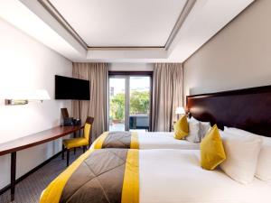 Ένα ή περισσότερα κρεβάτια σε δωμάτιο στο Le Diwan Hotel Rabat - MGallery Collection