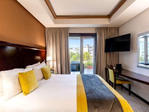 Ένα ή περισσότερα κρεβάτια σε δωμάτιο στο Le Diwan Hotel Rabat - MGallery Collection