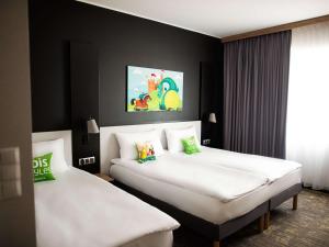 Posteľ alebo postele v izbe v ubytovaní ibis styles Grudziadz