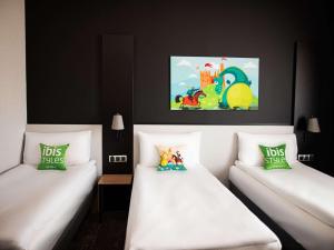 Posteľ alebo postele v izbe v ubytovaní ibis styles Grudziadz