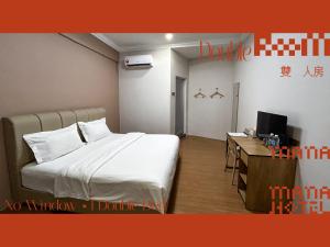 Postel nebo postele na pokoji v ubytování Mana Mana Hotel • Melaka •