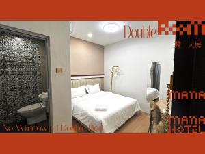 Postel nebo postele na pokoji v ubytování Mana Mana Hotel • Melaka •