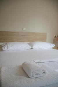Postel nebo postele na pokoji v ubytování Nirvana Homes