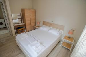 Postel nebo postele na pokoji v ubytování Nirvana Homes