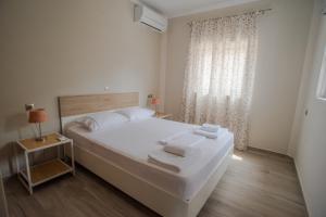 Postel nebo postele na pokoji v ubytování Nirvana Homes