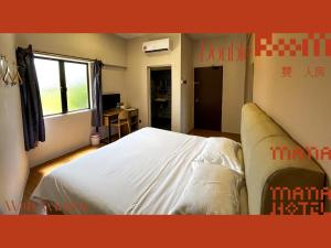 Postel nebo postele na pokoji v ubytování Mana Mana Hotel • Melaka •