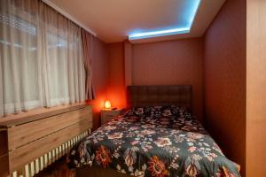 Postel nebo postele na pokoji v ubytování Apartmani Dambo