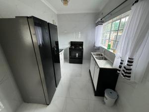 Η κουζίνα ή μικρή κουζίνα στο Yeta apartments