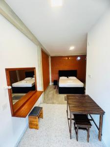 Postel nebo postele na pokoji v ubytování Resolve Garden Hotel