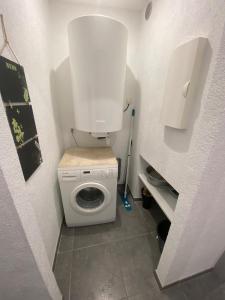 a small bathroom with a white toilet in a room at Place du bonheur bel appartement f2 in Sarrebourg +5 photos