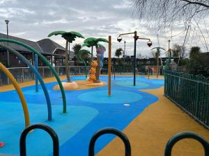 a playground with a water park with a water slide at Haven Caravan Park Cala Gran in Fleetwood
