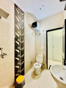 a bathroom with a toilet and a sink at Couples and family welcome for stay in Kharar +16 photos