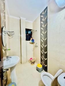 a bathroom with a toilet and a sink at Couples and family welcome for stay in Kharar
