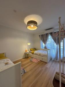 a bedroom with a bed and a large window at Koombana Bay beach Homestay in Bunbury +45 photos
