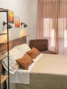 Postel nebo postele na pokoji v ubytování Big Fish Alghero Guesthouse