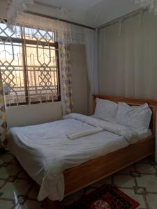 Postel nebo postele na pokoji v ubytování Sweetland view hotel