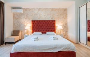 Postel nebo postele na pokoji v ubytování Rivendell Boutique Hotel Tbilisi City