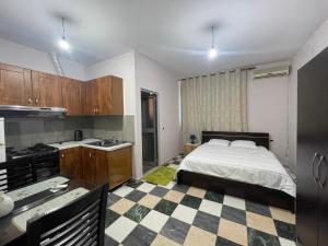 Postel nebo postele na pokoji v ubytování Bajovah Apartments & Restaurant