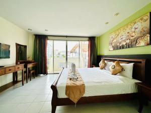 Postel nebo postele na pokoji v ubytování Sea Boss Homestay