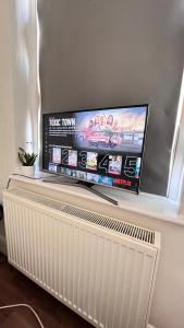 Μια τηλεόραση ή/και κέντρο ψυχαγωγίας στο W12 ensuite