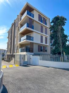 a large apartment building with a parking lot at Appartement Alchimy in Antibes