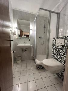 Koupelna v ubytování Hotel Schmärrnche